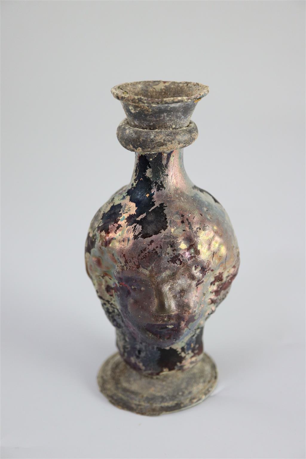 A Roman amethyst glass ewer, 1st/2nd century AD, 15.2cm high